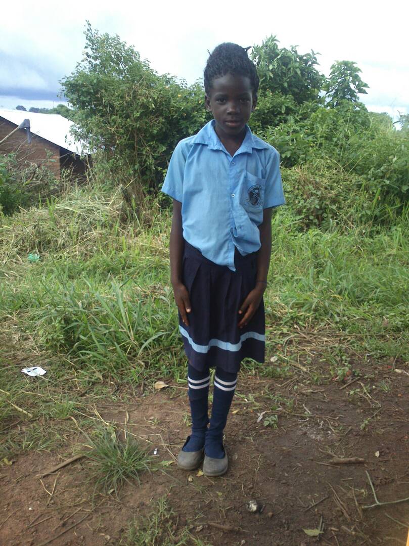 Mary Gorret Karungi. 7 years.